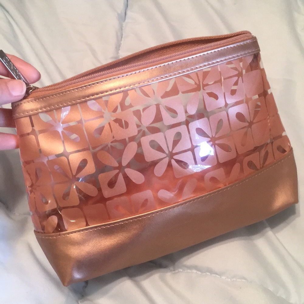 Clinique cosmetic zipper bag /copper metallic